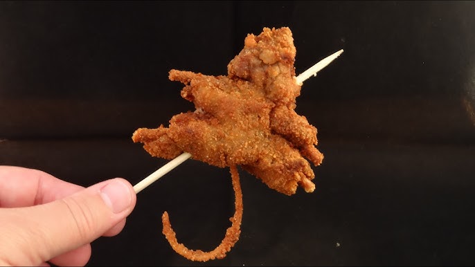 A rat on a stick. Click to eat.